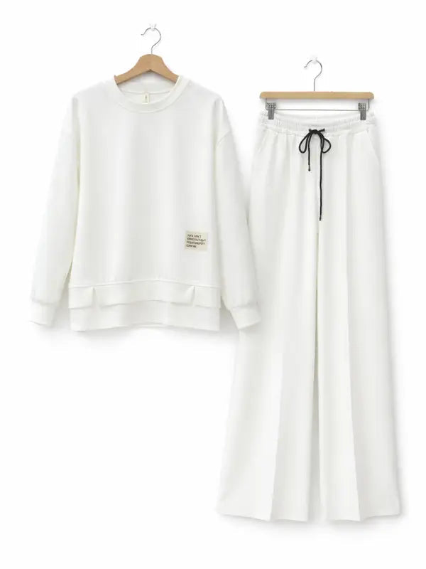 Tuta da donna: felpa con cappuccio e pantaloni della tuta, abbigliamento casual, semplice stile a gamba dritta.