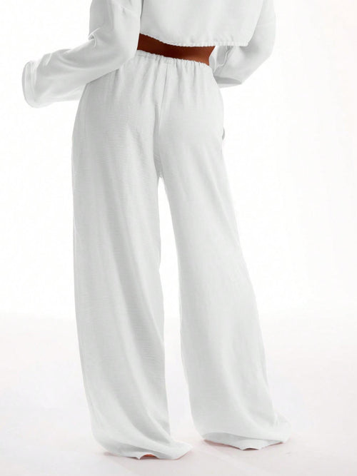 Pantaloni tinta unita con tasche da donna