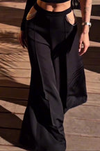 Débardeur court femme noir à licou et ras-de-cou, découpes, chaîne en strass, pantalon large