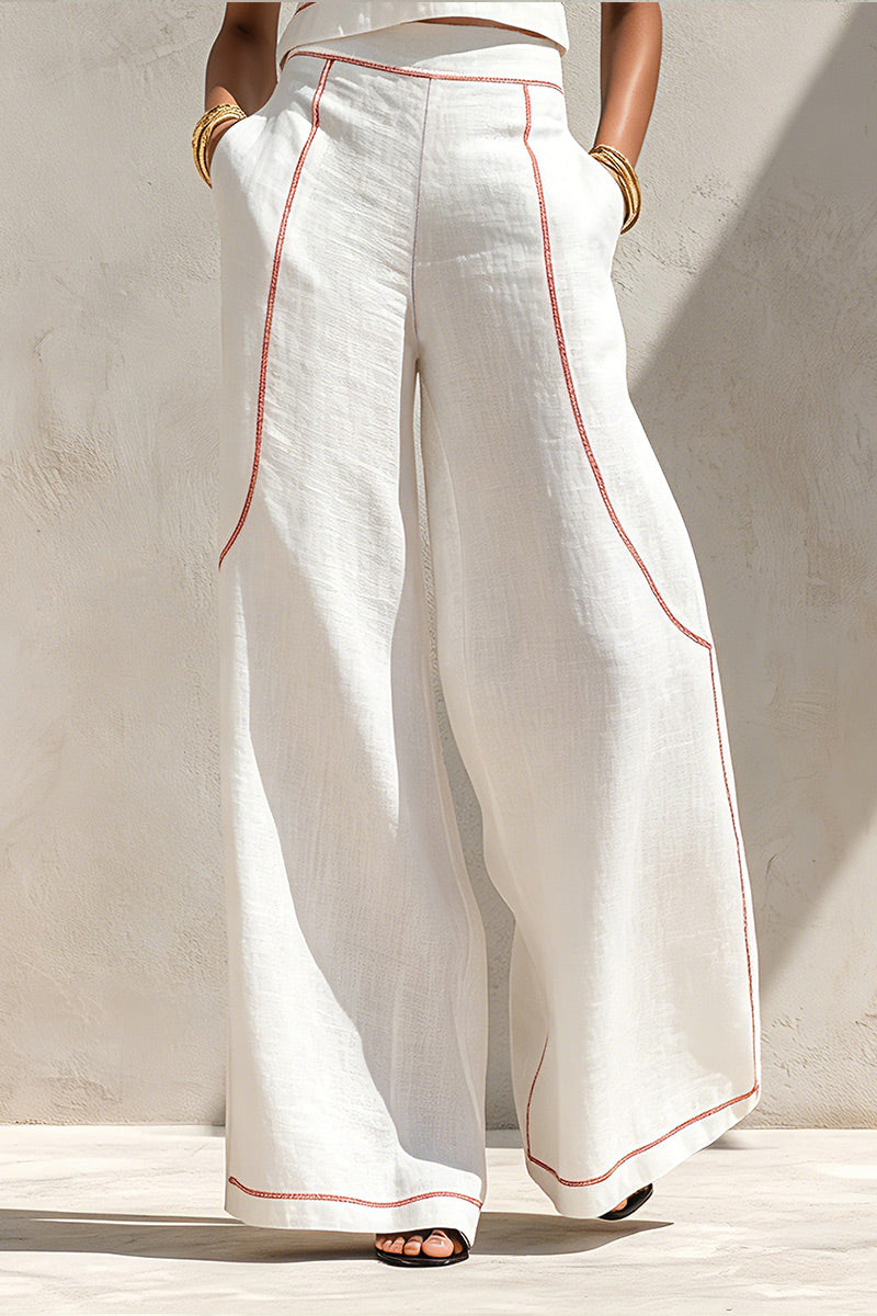 Gilet sans manches rouge en lin, col rond, surpiqûres contrastantes, coupe courte OU Pantalon large en lin, surpiqûres rehaussées, coupe décontractée et longueur normale