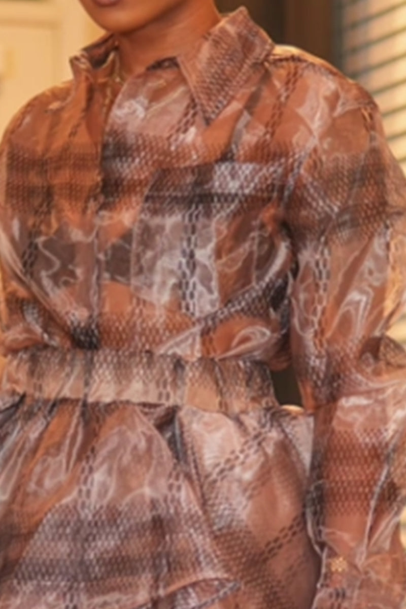 Haut long style villégiature ou mini-jupe volumineuse imprimé femme