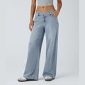 Jeans casual asimmetrici a vita bassa con tasche con cerniera, taglio ampio e slavato