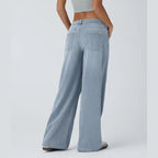 Jeans casual asimmetrici a vita bassa con tasche con cerniera, taglio ampio e slavato