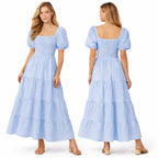 Longue robe smockée pour femme, manches bouffantes, coupe fluide à volants, style élégant pour l'été.