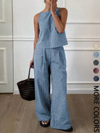 Ensemble décontracté deux pièces d'été pour femme, composé d'un débardeur léger à rayures fines et d'un pantalon long ample, ensemble confortable et élégant.