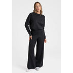 Completo due pezzi in maglia: T-shirt a maniche lunghe, girocollo, pantaloni con elastico in vita, maglia di medio spessore, comodo e versatile, abbigliamento femminile, adatto all'uso quotidiano, specialmente per i cambi di stagione.