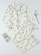 Pigiama da donna a maniche lunghe a righe con stampa a fiocco, grazioso set con parte superiore abbottonata e pantaloni, abbigliamento casual per la casa per tutte le stagioni