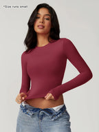 T-shirt sportiva da donna a girocollo tinta unita a compressione