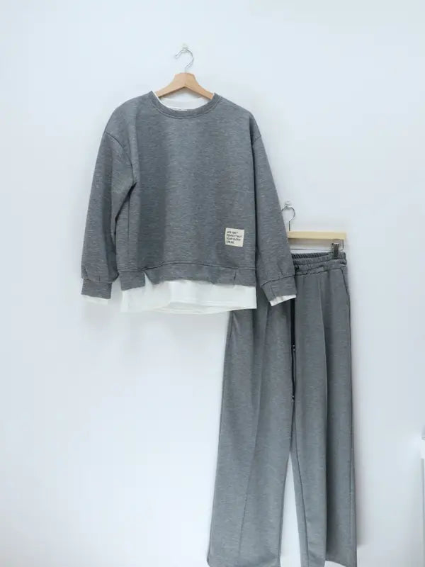 Tuta da donna: felpa con cappuccio e pantaloni della tuta, abbigliamento casual, semplice stile a gamba dritta.
