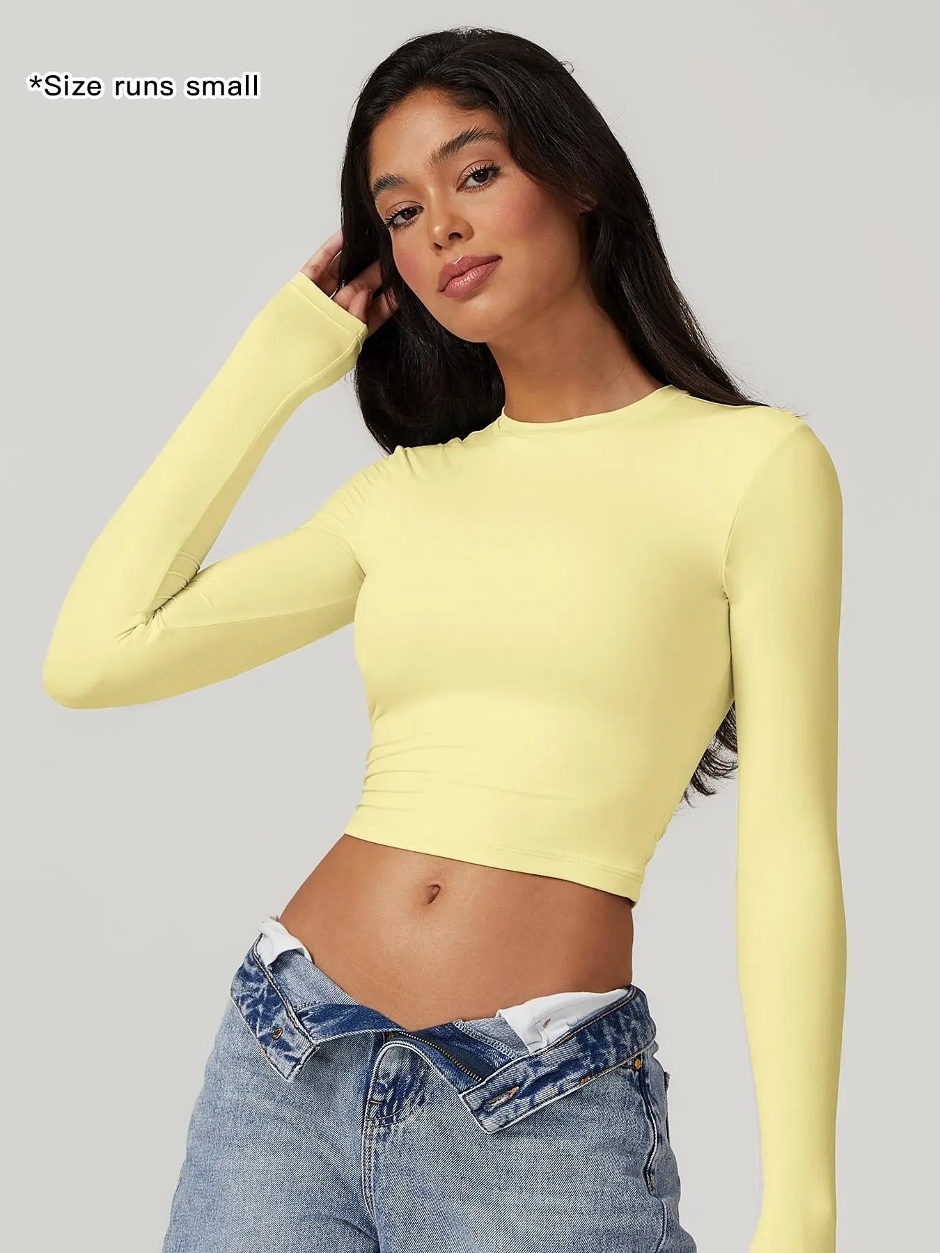 T-shirt sportiva da donna a girocollo tinta unita a compressione