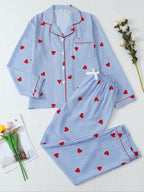 Pigiama da donna a maniche lunghe a righe con stampa a fiocco, grazioso set con parte superiore abbottonata e pantaloni, abbigliamento casual per la casa per tutte le stagioni