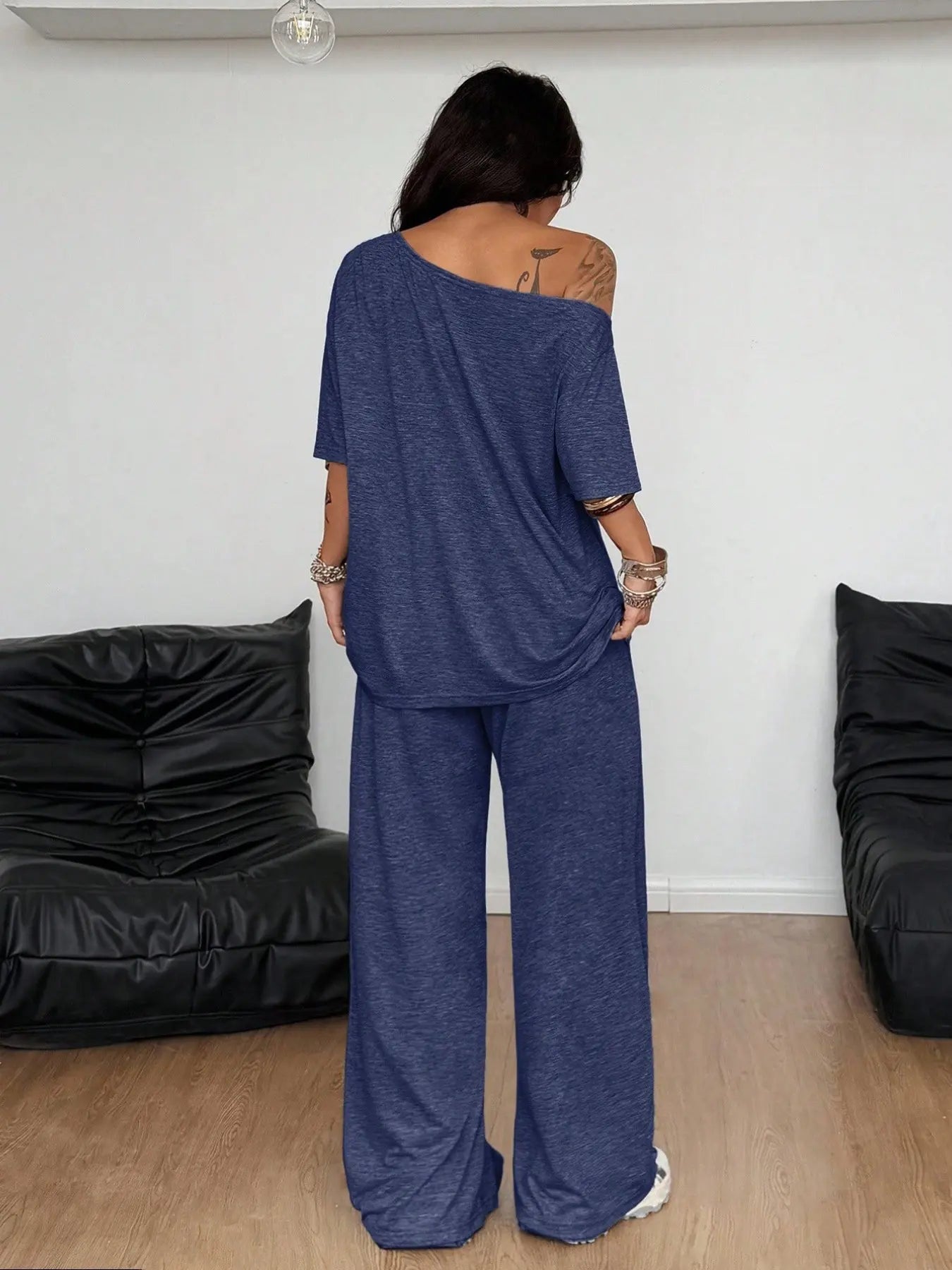 Ensemble deux pièces décontracté de sport de couleur unie pour femme, pantalon long ample et costume à col oblique à jambes larges, mode printemps et automne.