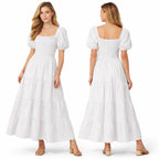 Longue robe smockée pour femme, manches bouffantes, coupe fluide à volants, style élégant pour l'été.