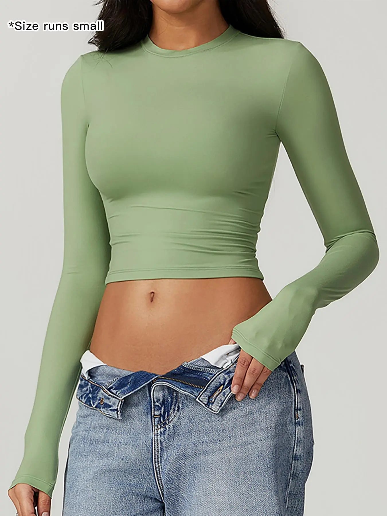 T-shirt sportiva da donna a girocollo tinta unita a compressione