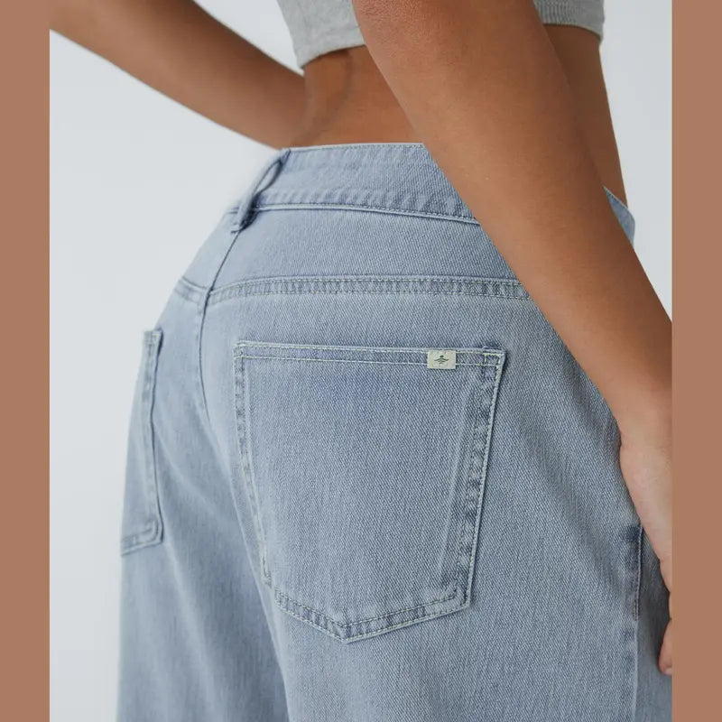 Jeans casual asimmetrici a vita bassa con tasche con cerniera, taglio ampio e slavato
