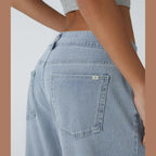 Jeans casual asimmetrici a vita bassa con tasche con cerniera, taglio ampio e slavato