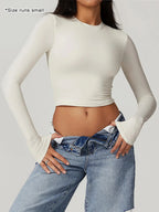 T-shirt sportiva da donna a girocollo tinta unita a compressione