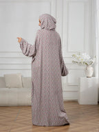 Plus-Size Fashion Floral Dress with Hood and Drawstring — featuring a loose fit, long lantern sleeves, and a modest yet casual style.
